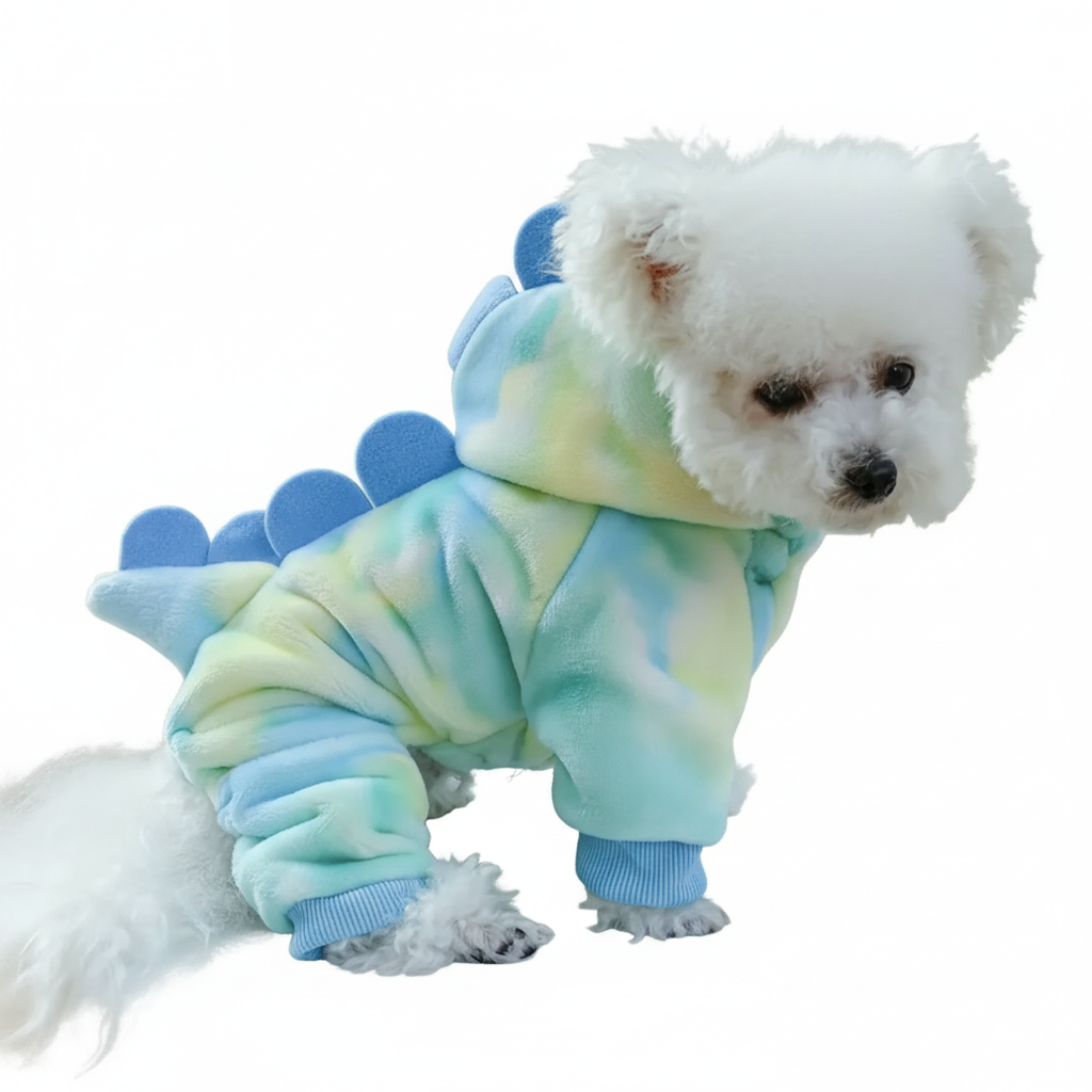 White dog in sky blue dinosaur costume on plain background